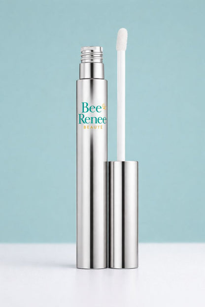 Metallic lip balm with applicator on a light blue background