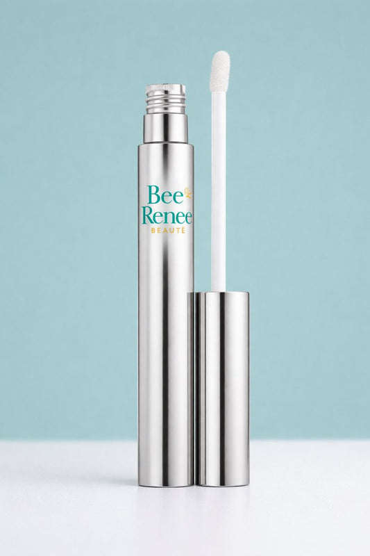 Metallic lip balm with applicator on a light blue background